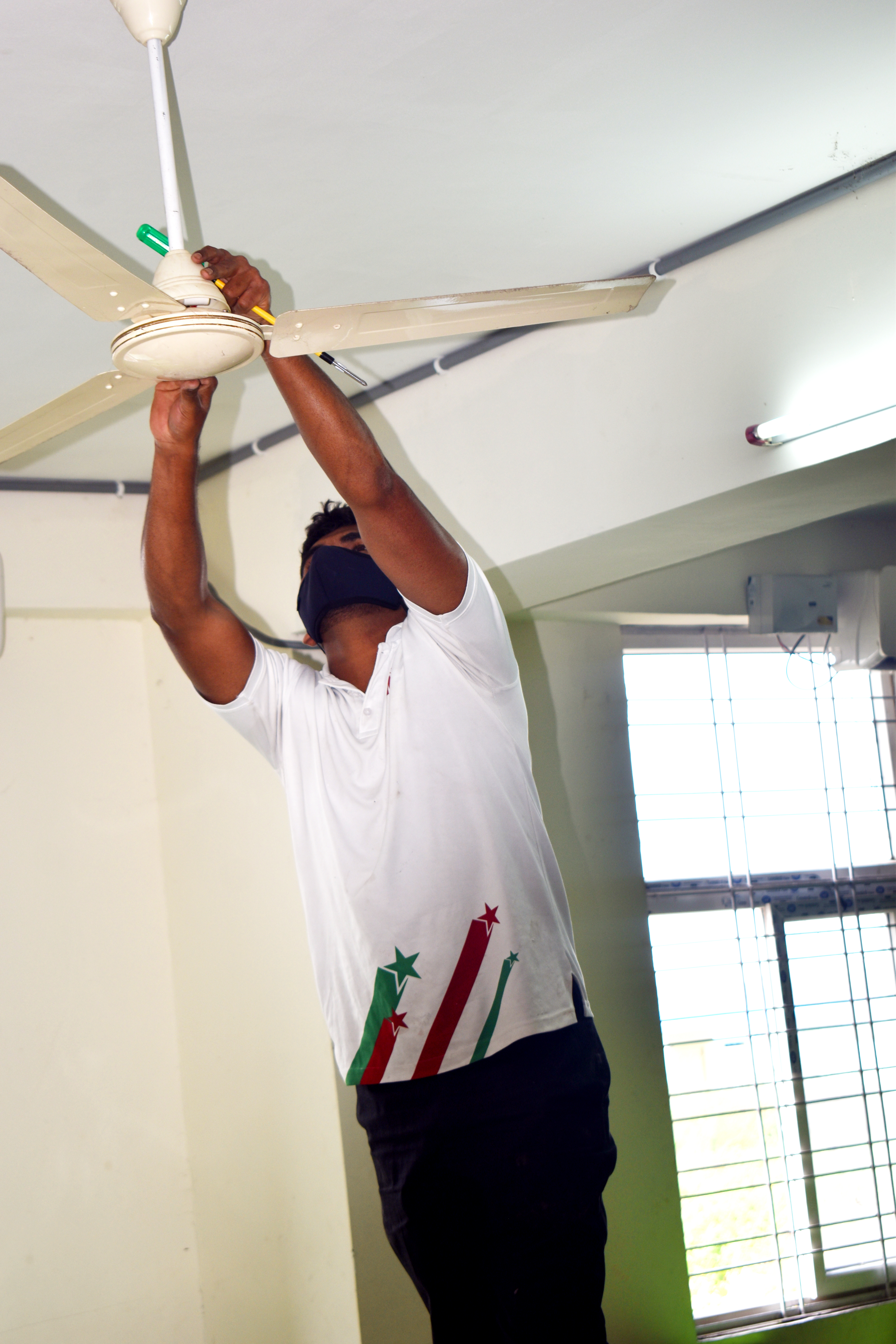 Electrical technician working on panel